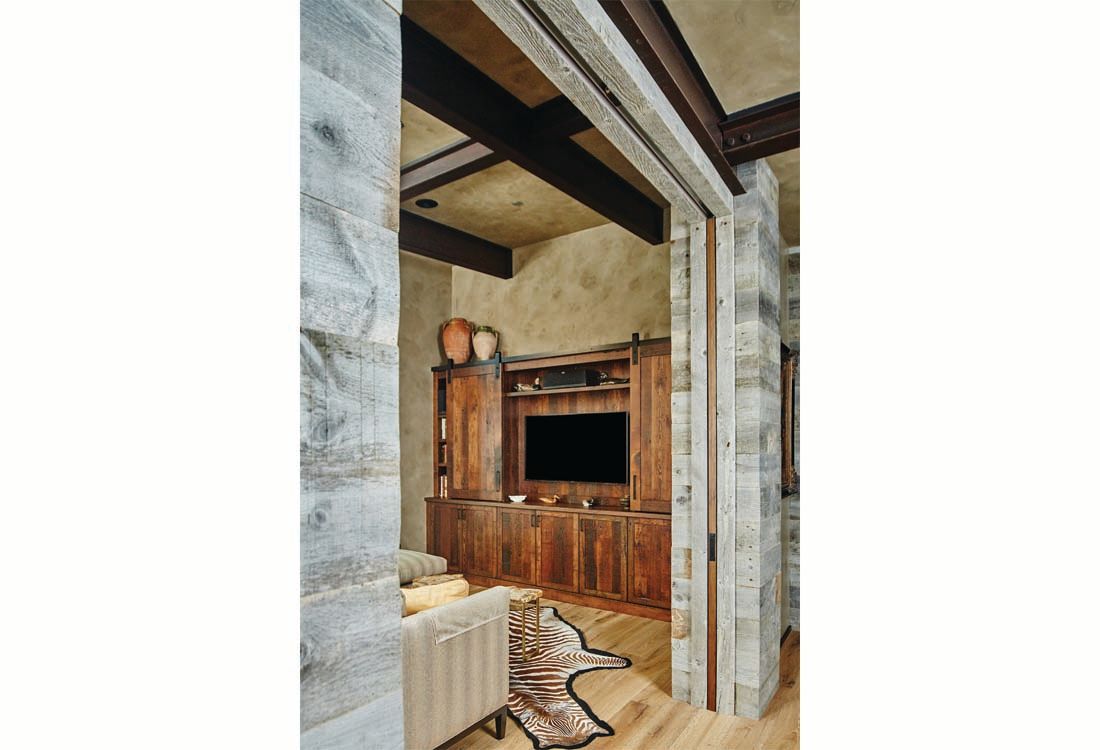 A living room with a couch and a flat screen tv.