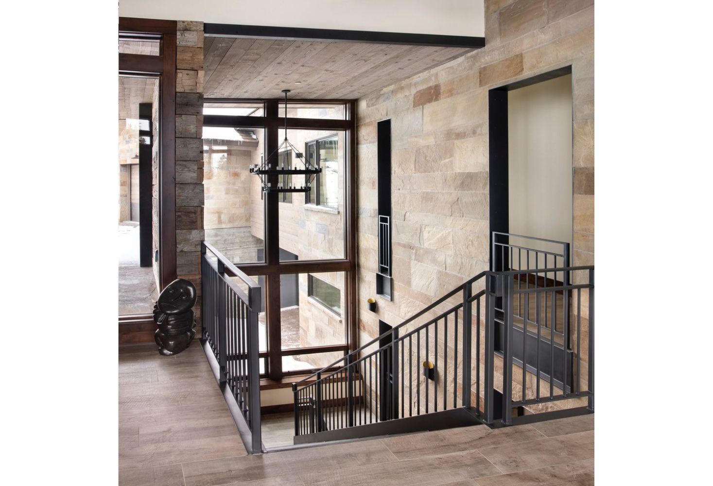 A picture of a staircase in a building with a metal railing.