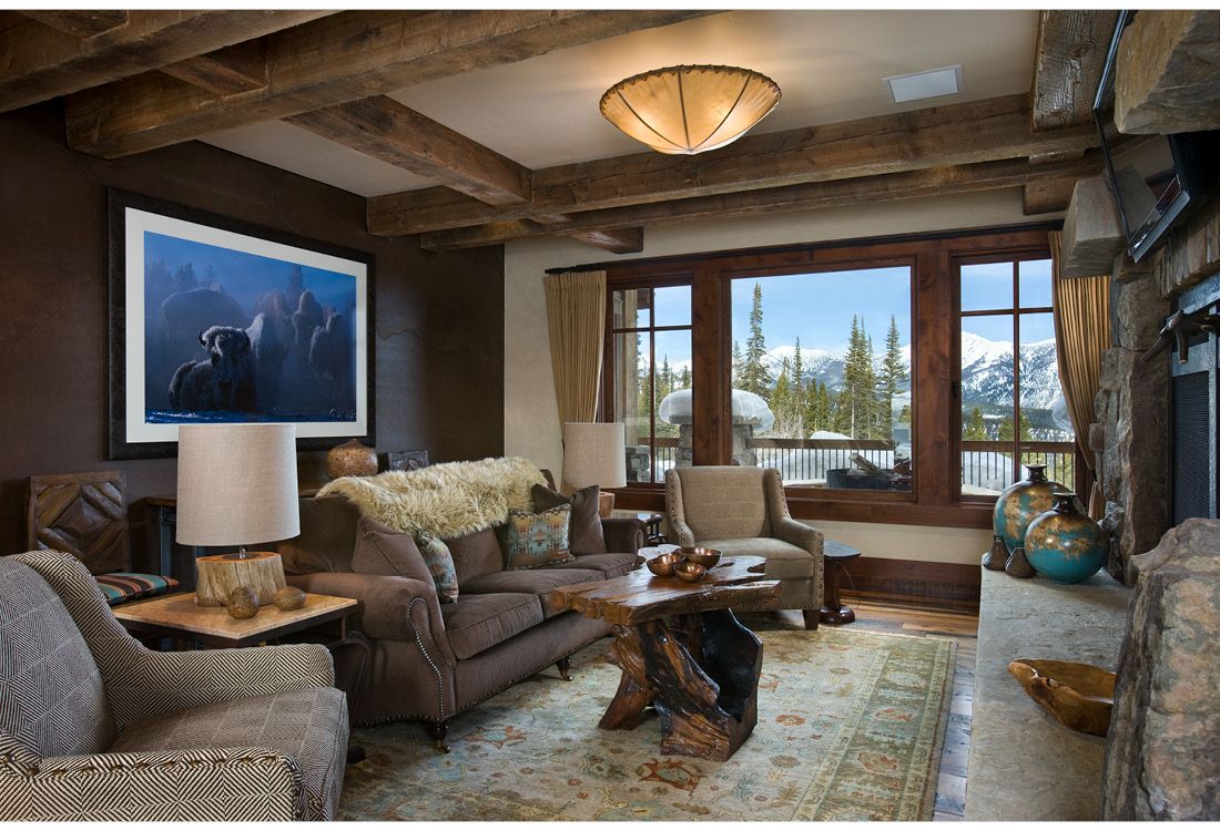 A living room with a lot of furniture and a fireplace