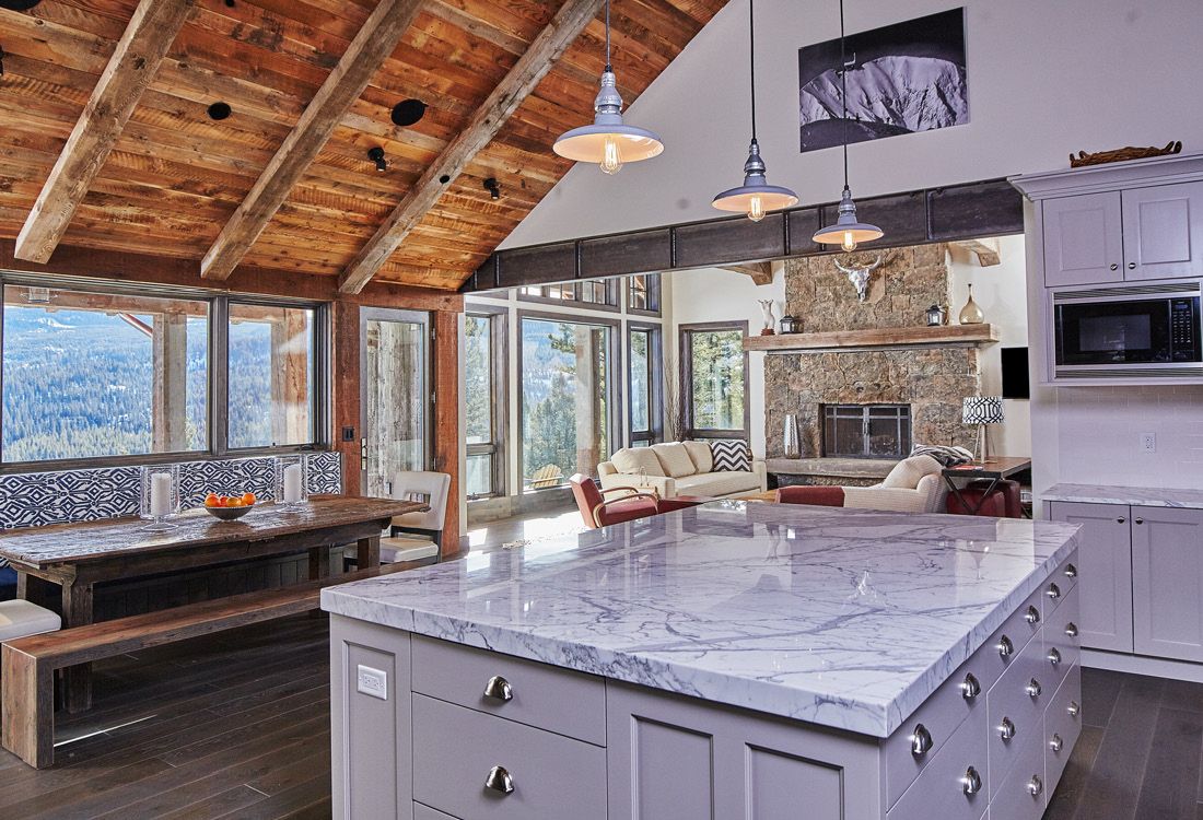 There is a large island in the middle of the kitchen.