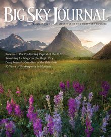 The cover of the big sky journal magazine with purple flowers and mountains in the background.