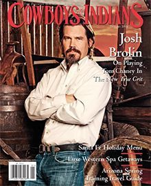 A man with a beard is on the cover of a magazine.