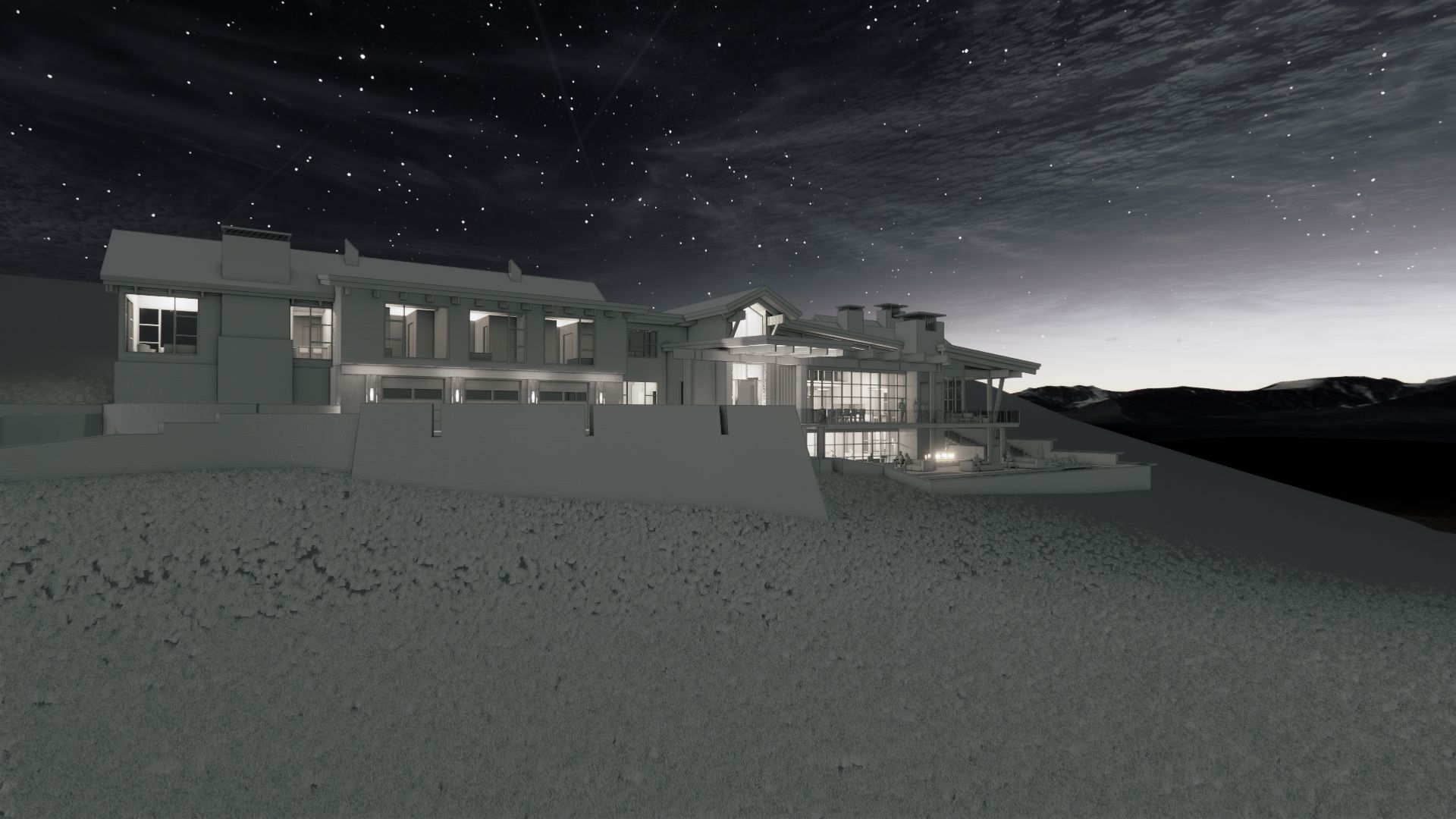 A black and white photo of a large house at night.