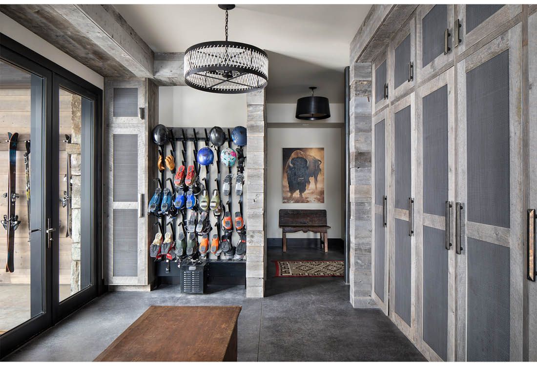 A hallway with a lot of cabinets and a painting on the wall.