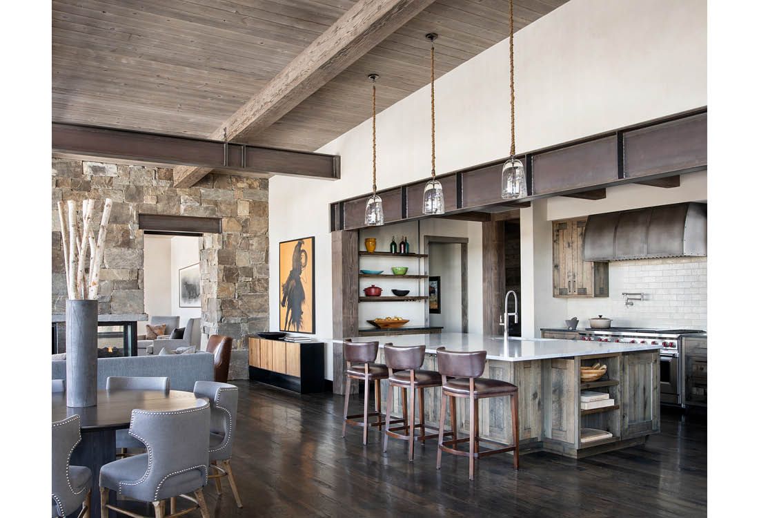 A kitchen with a large island in the middle of the room.