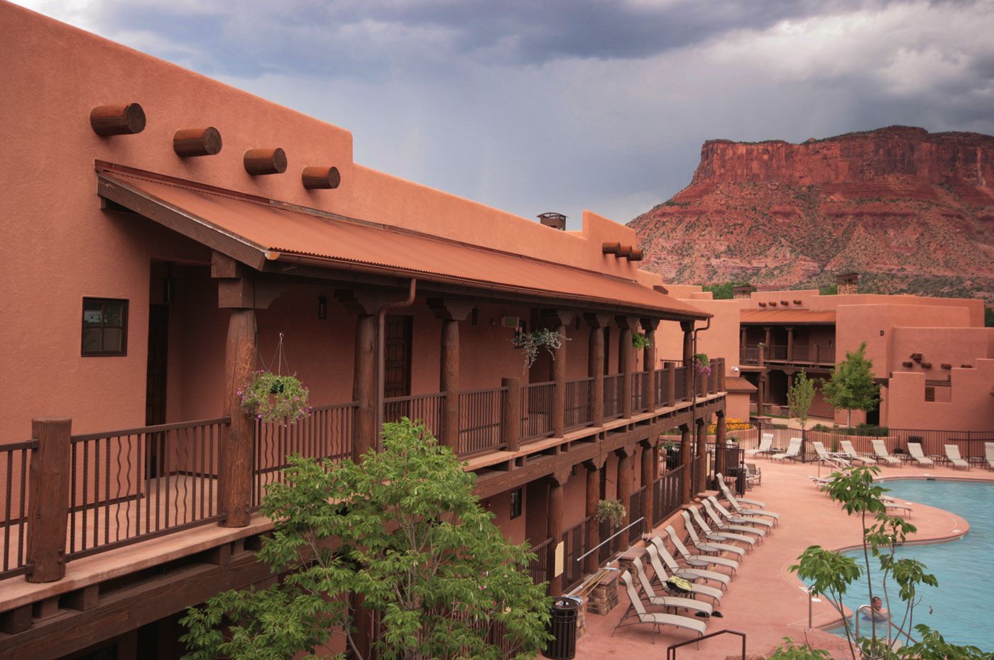 A large building with a swimming pool in front of it