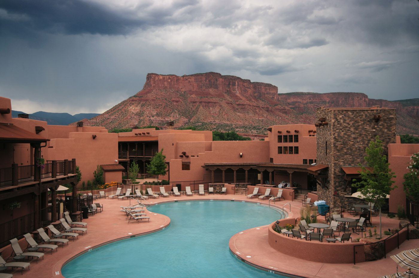 A large swimming pool with a mountain in the background