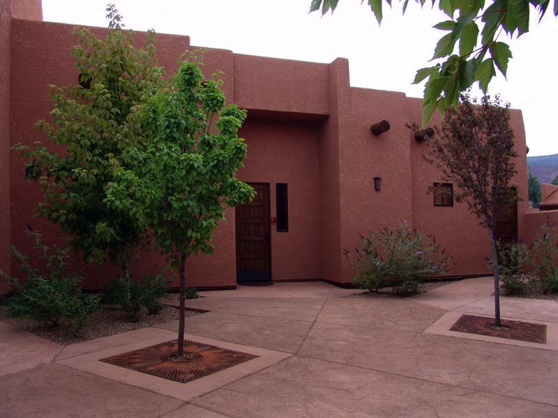 A brick building with trees in front of it