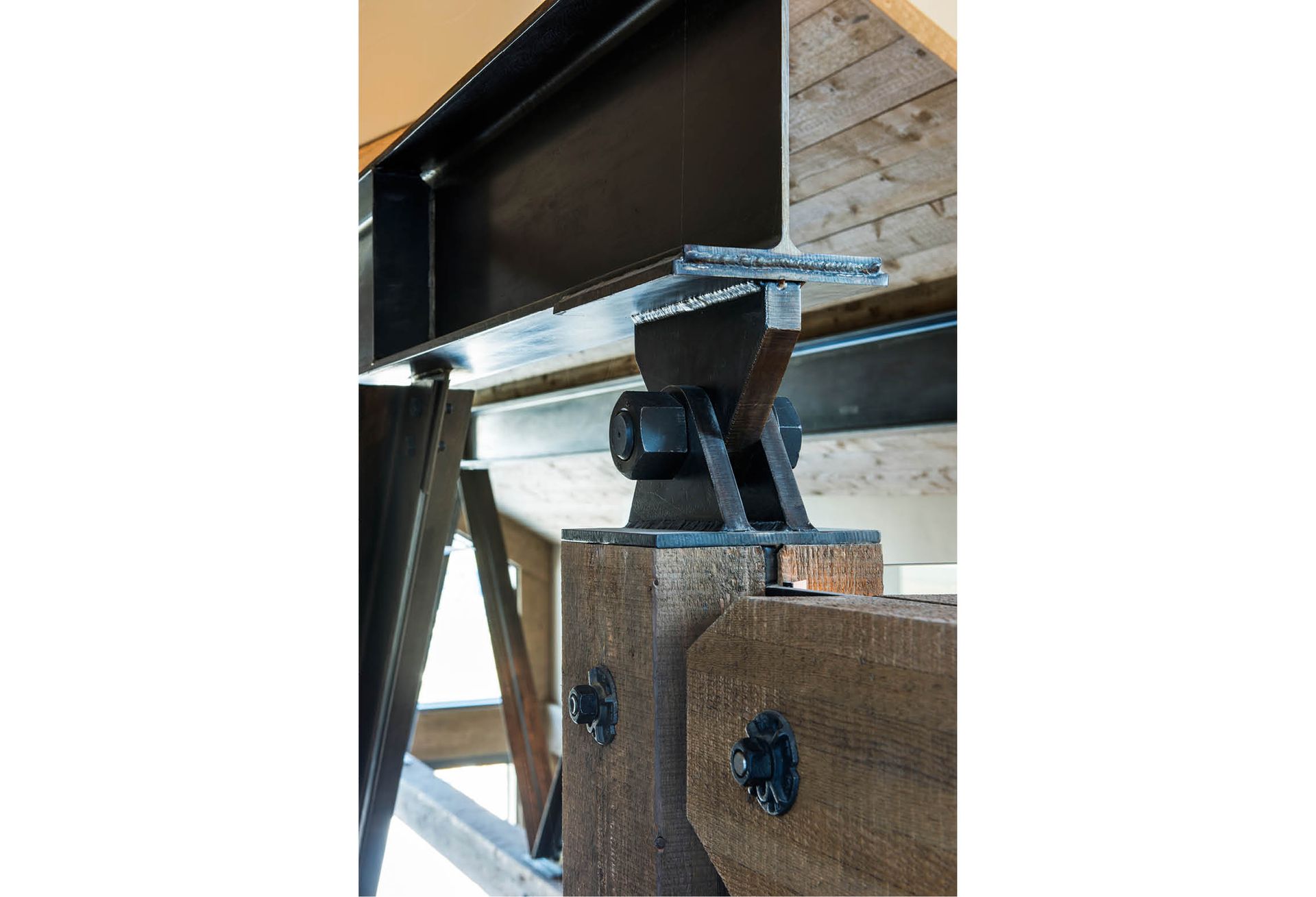 A close up of a metal structure on a white background.
