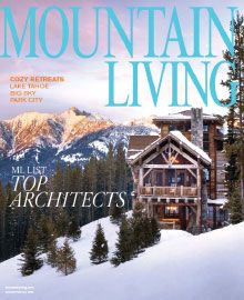 A mountain living magazine with a house on the cover