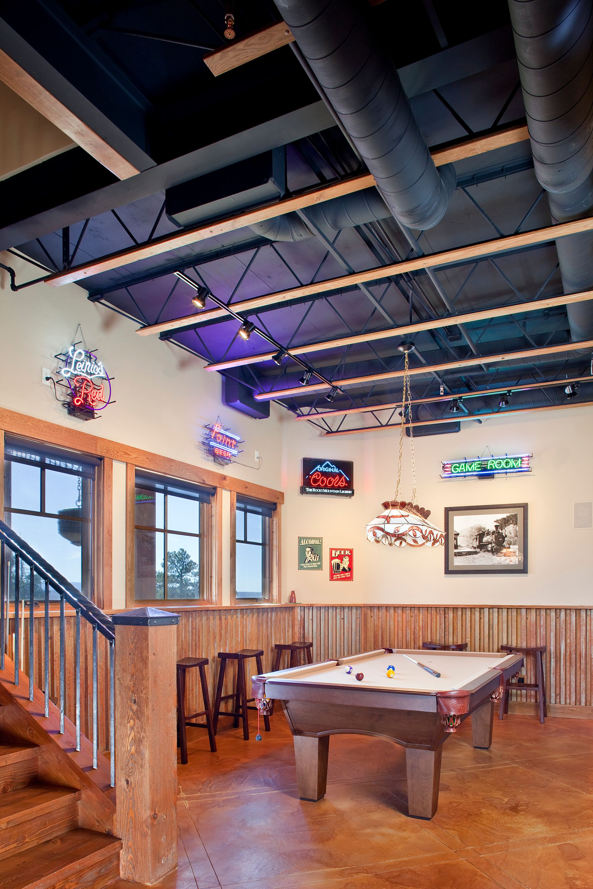 There is a pool table in the middle of the room.