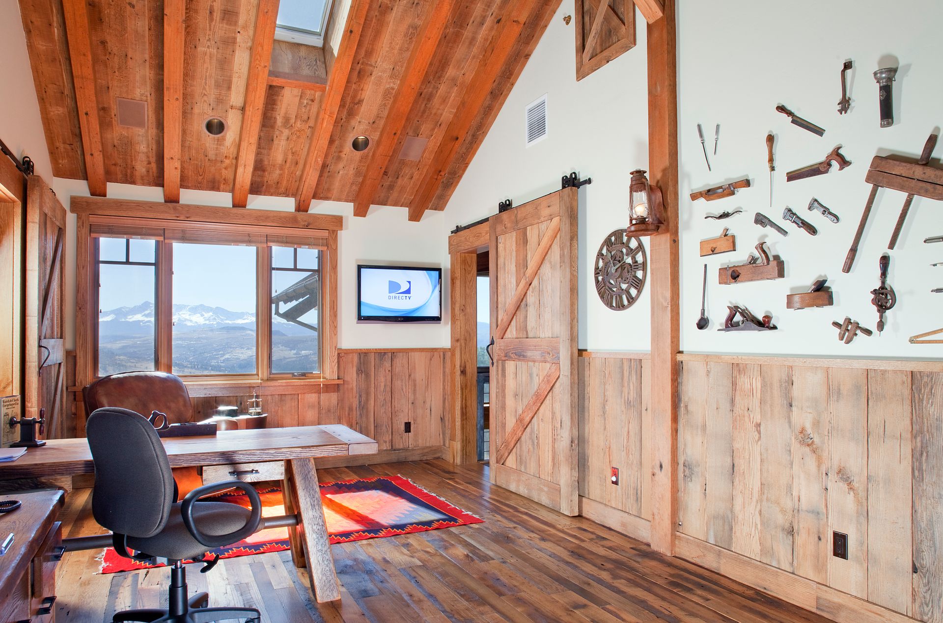 A room with wood paneling and a clock on the wall