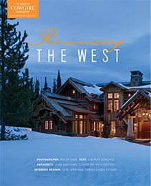 A large wooden house is covered in snow on the cover of a magazine.