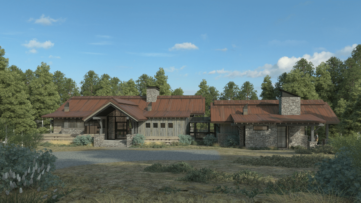 A large house with a red tile roof is surrounded by trees.