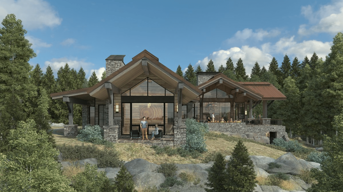 A house is sitting on top of a hill surrounded by trees.