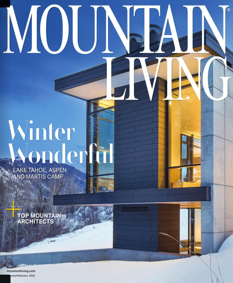 A mountain living magazine with a house on the cover