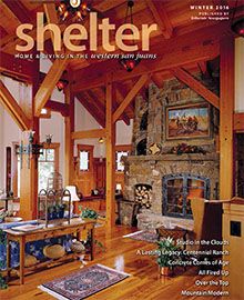 A living room with a fireplace on the cover of a magazine called shelter.