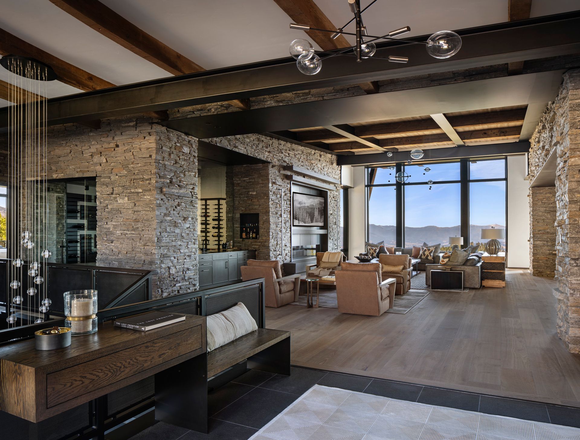 A living room with a lot of furniture and a large window