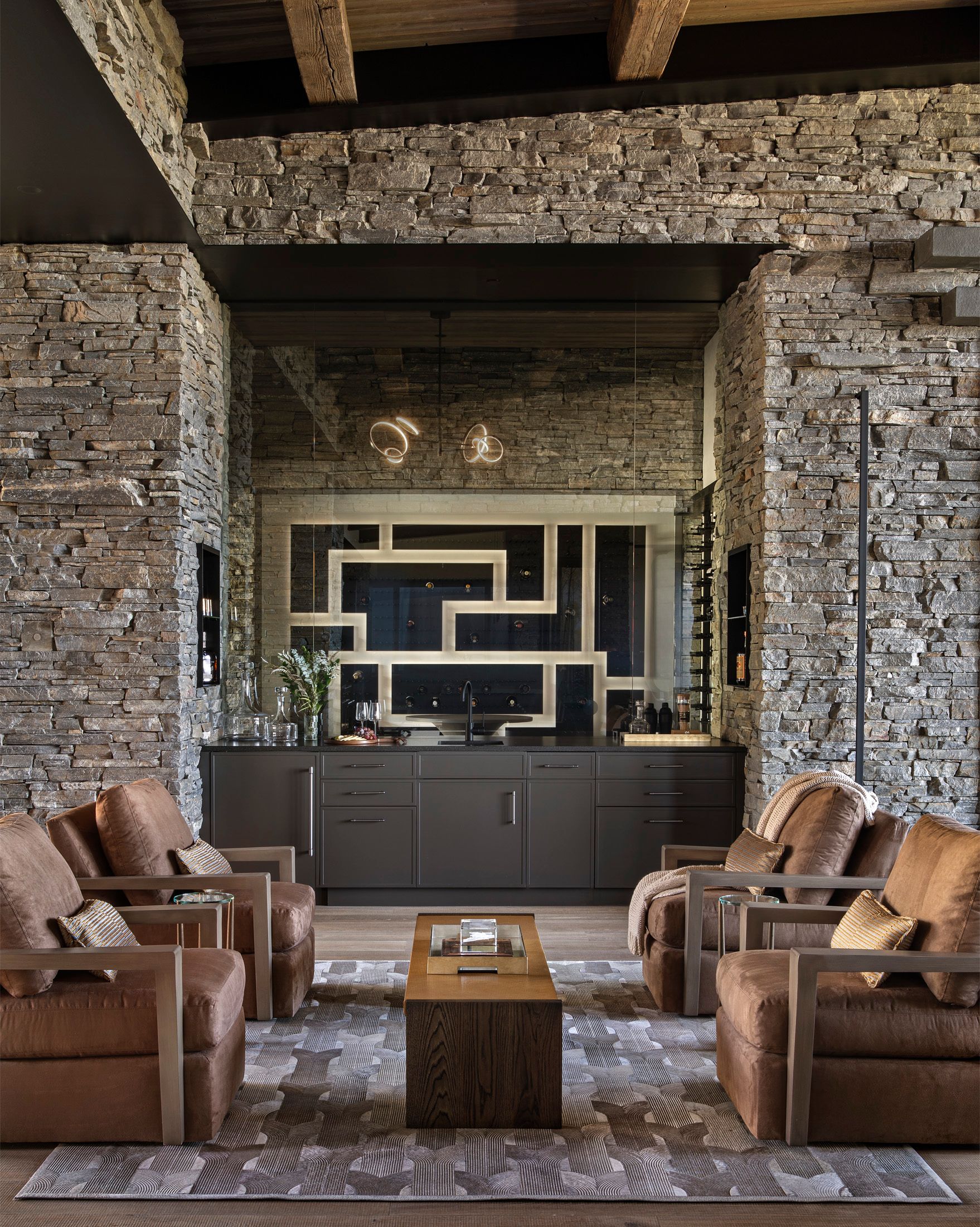 A living room filled with furniture and a brick wall