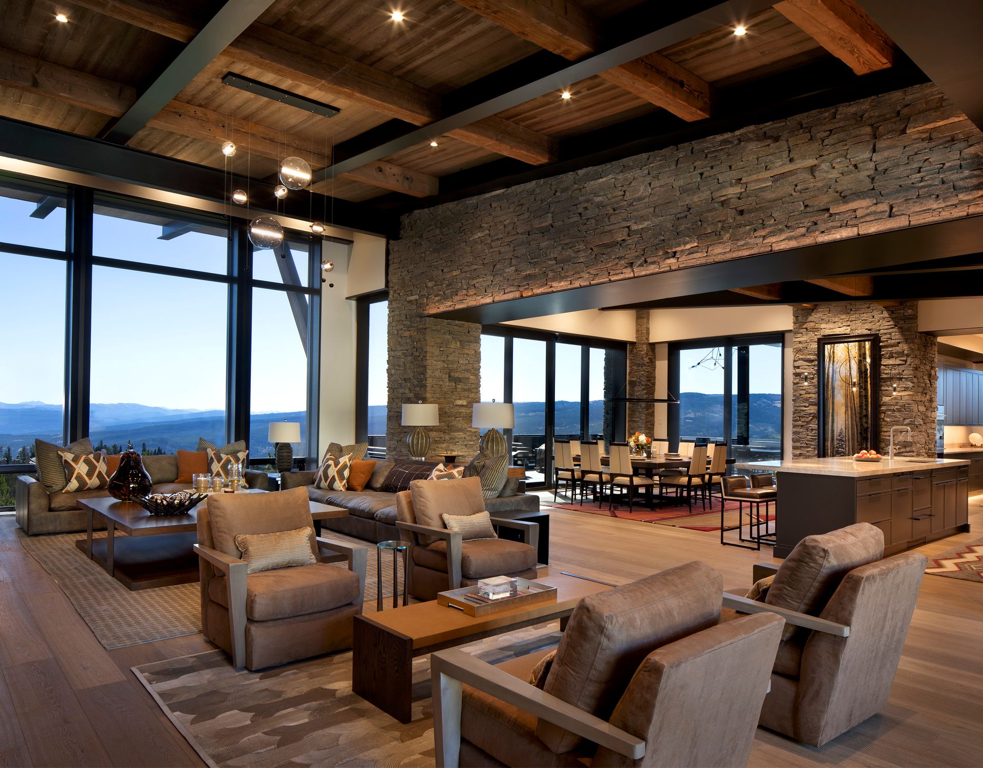 A living room with a lot of furniture and a large window