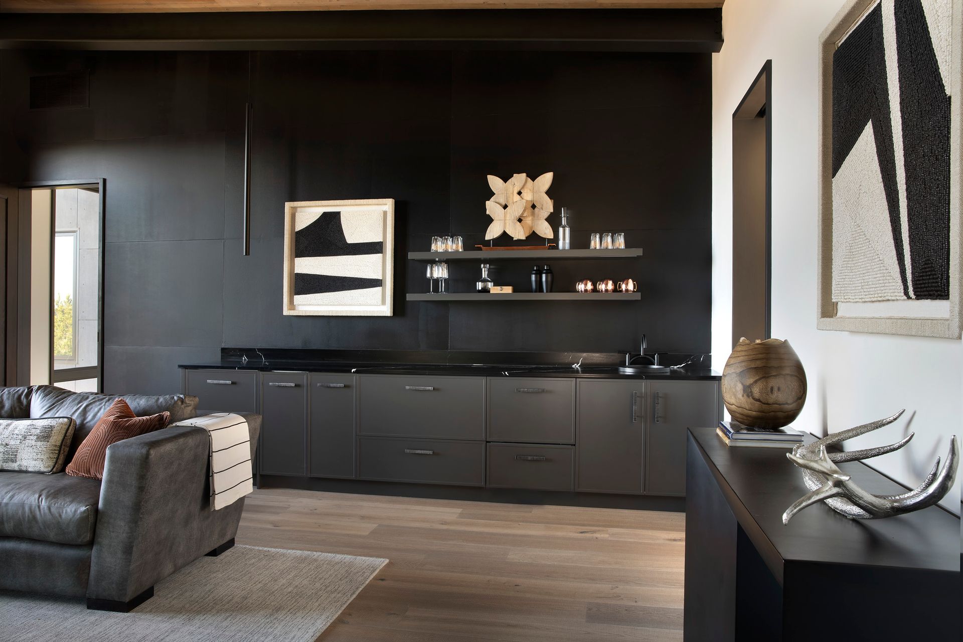 A living room with black cabinets and a couch