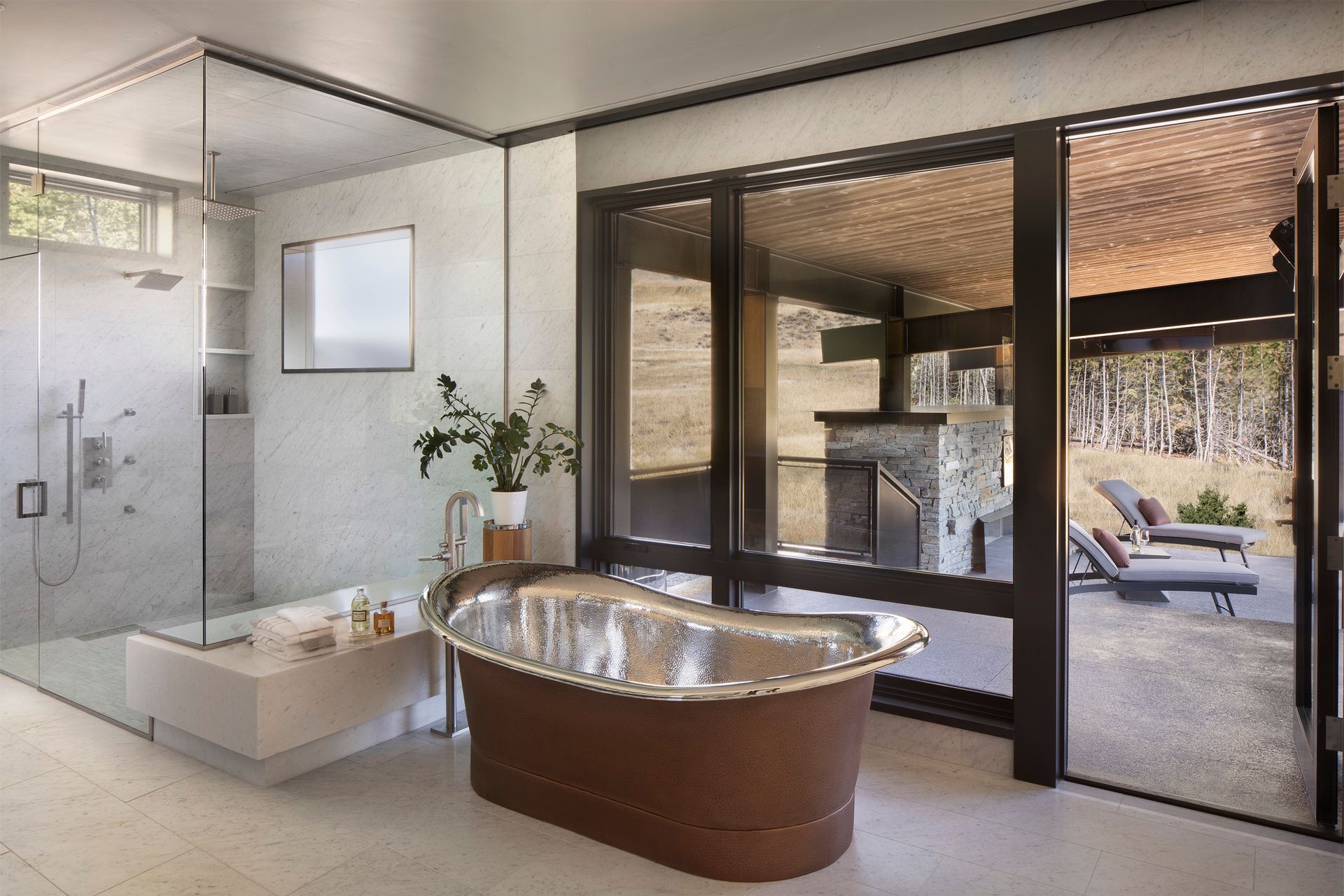 A bathroom with a bathtub and a walk in shower.