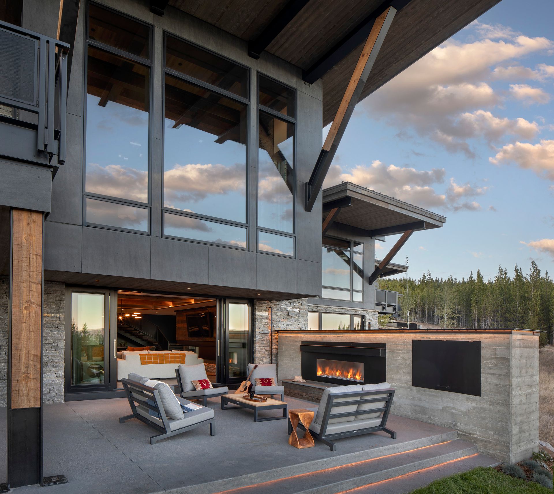A large house with a patio area and a fireplace