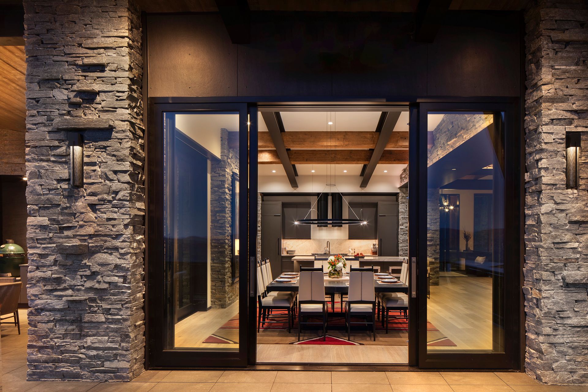 A large sliding glass door opens to a dining room