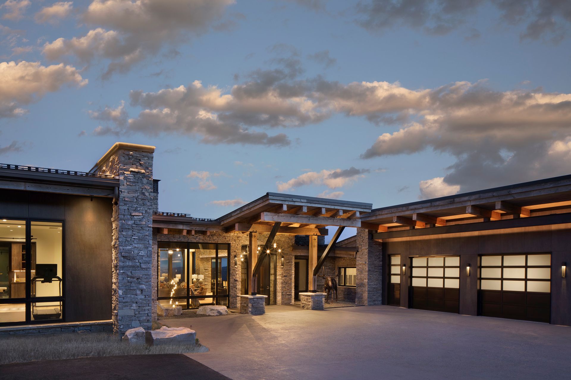 A large house with a lot of windows and a garage.