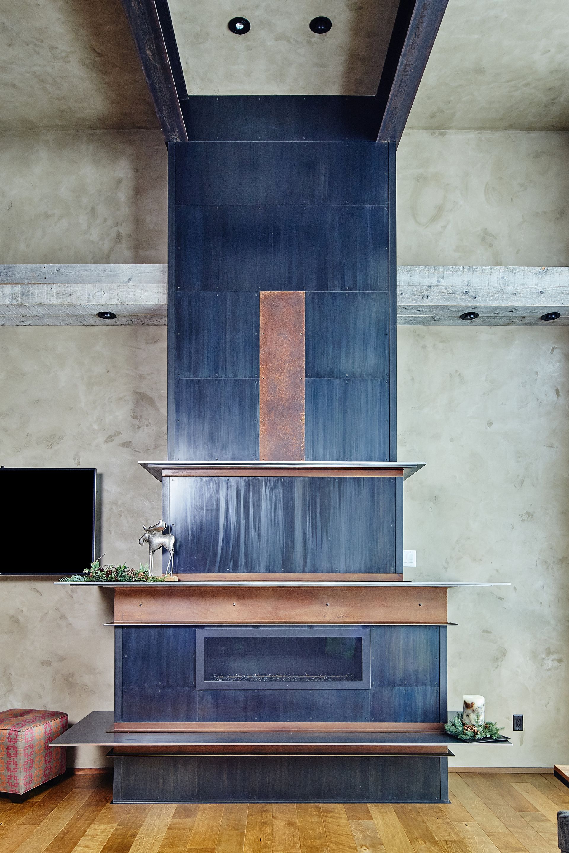 A living room with a fireplace and a flat screen tv