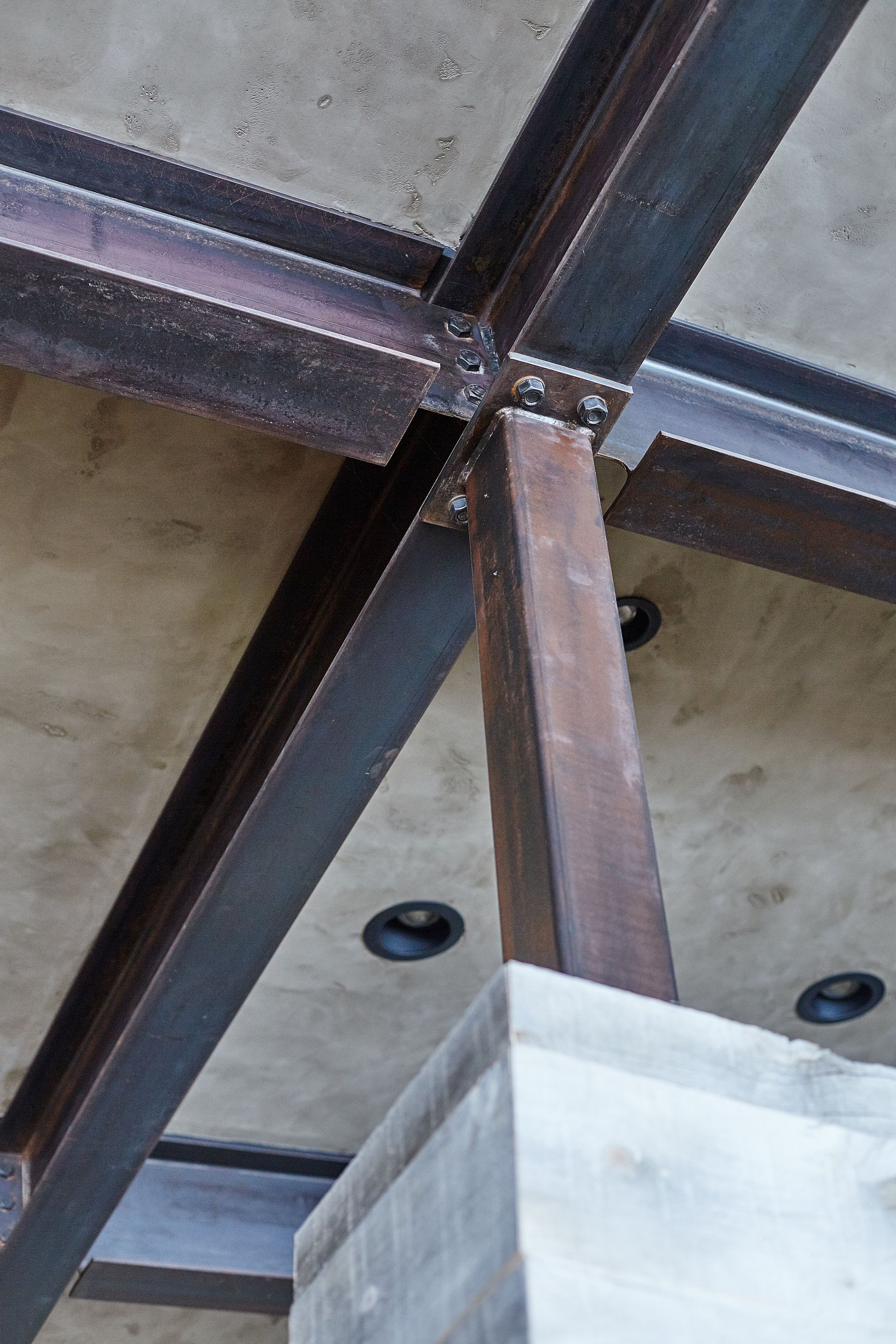 A close up of a metal structure in a building.
