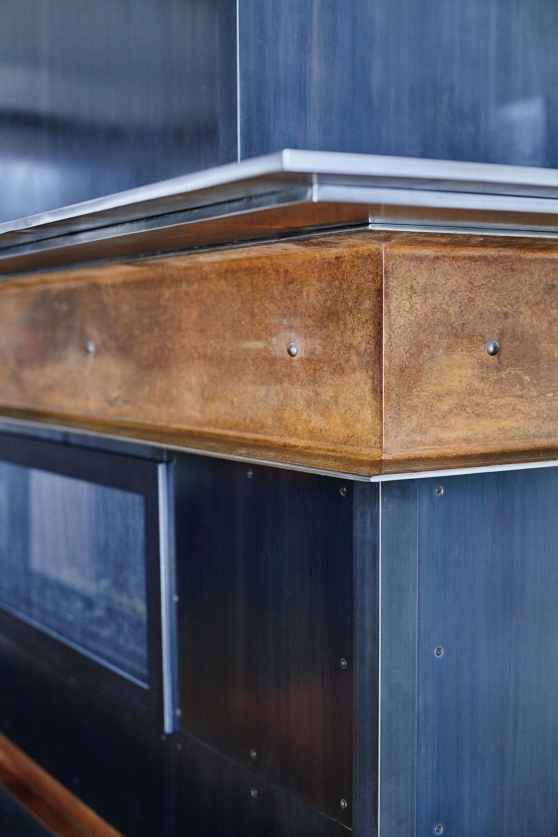 A close up of a wooden table with a metal frame