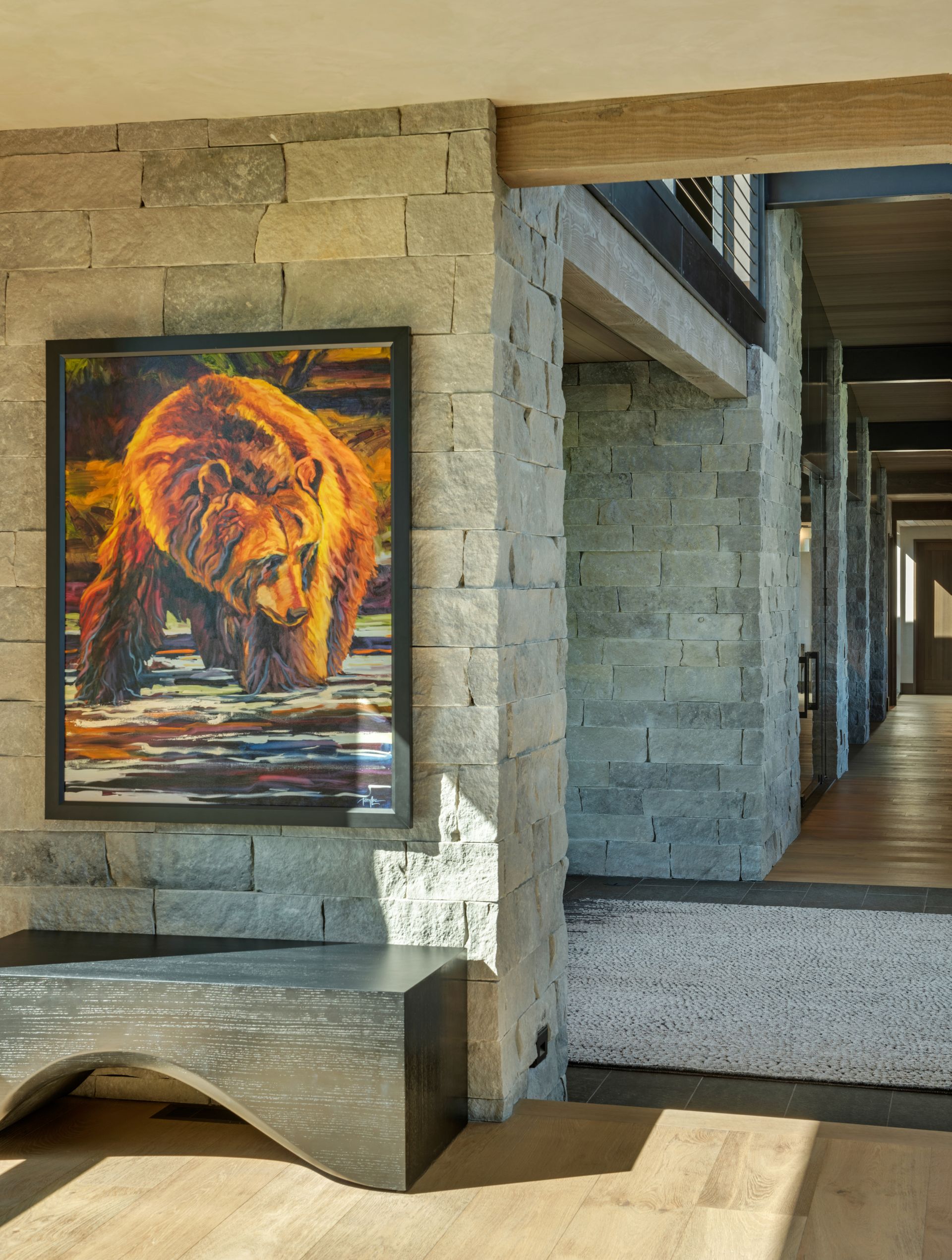 A painting of a bear is hanging on a wall