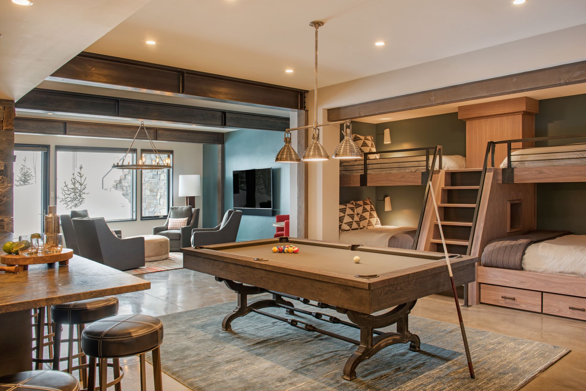 There is a pool table in the middle of the room.