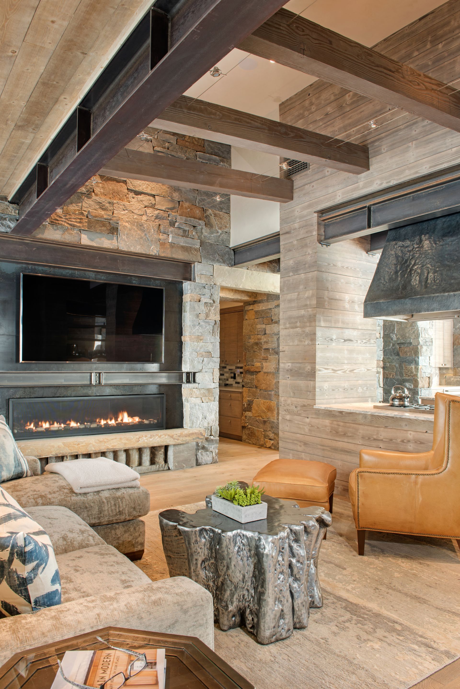 A living room with a fireplace and a flat screen tv.