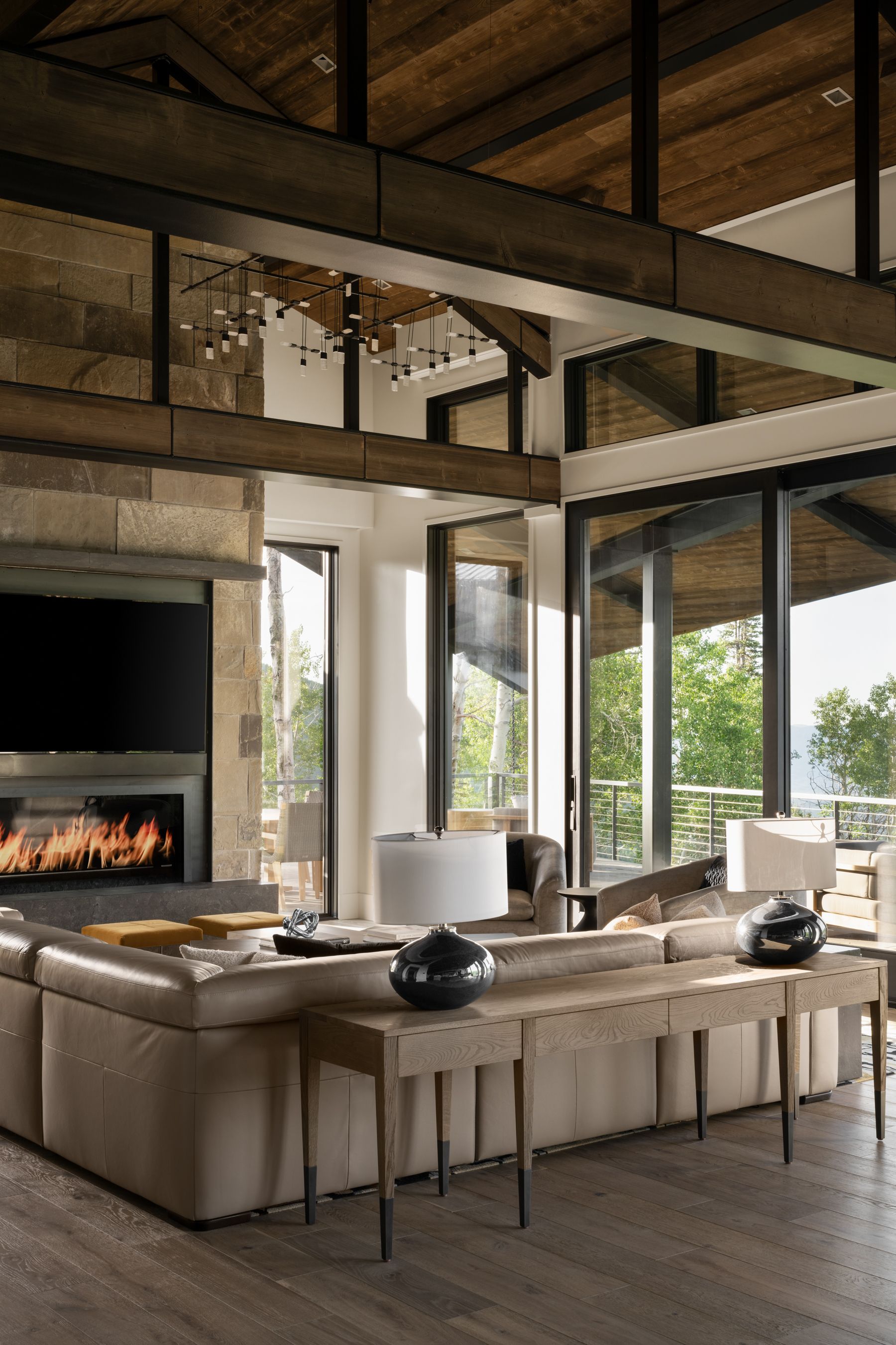 A living room with a large couch and a fireplace