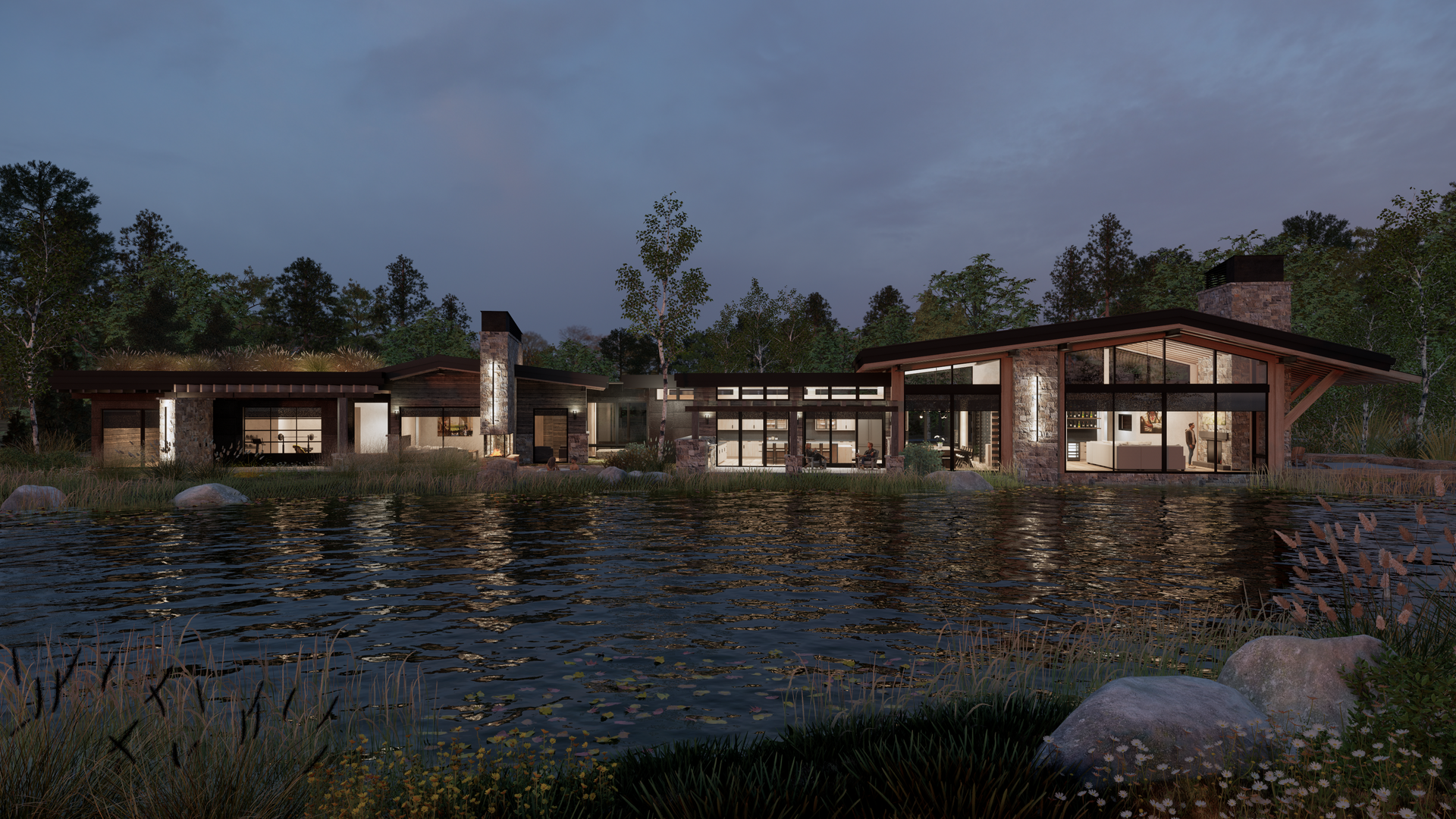 A large house is sitting next to a body of water.