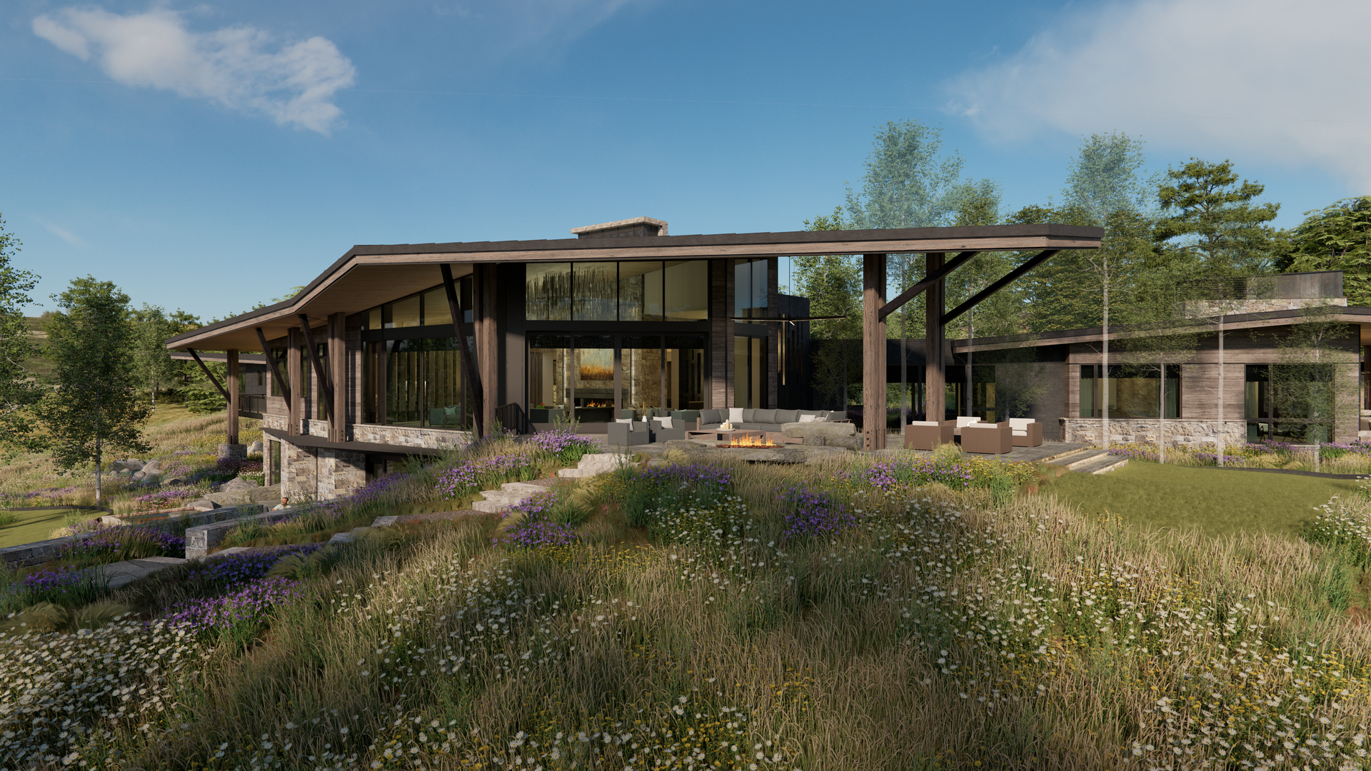 A large house is sitting on top of a grassy hill surrounded by trees.