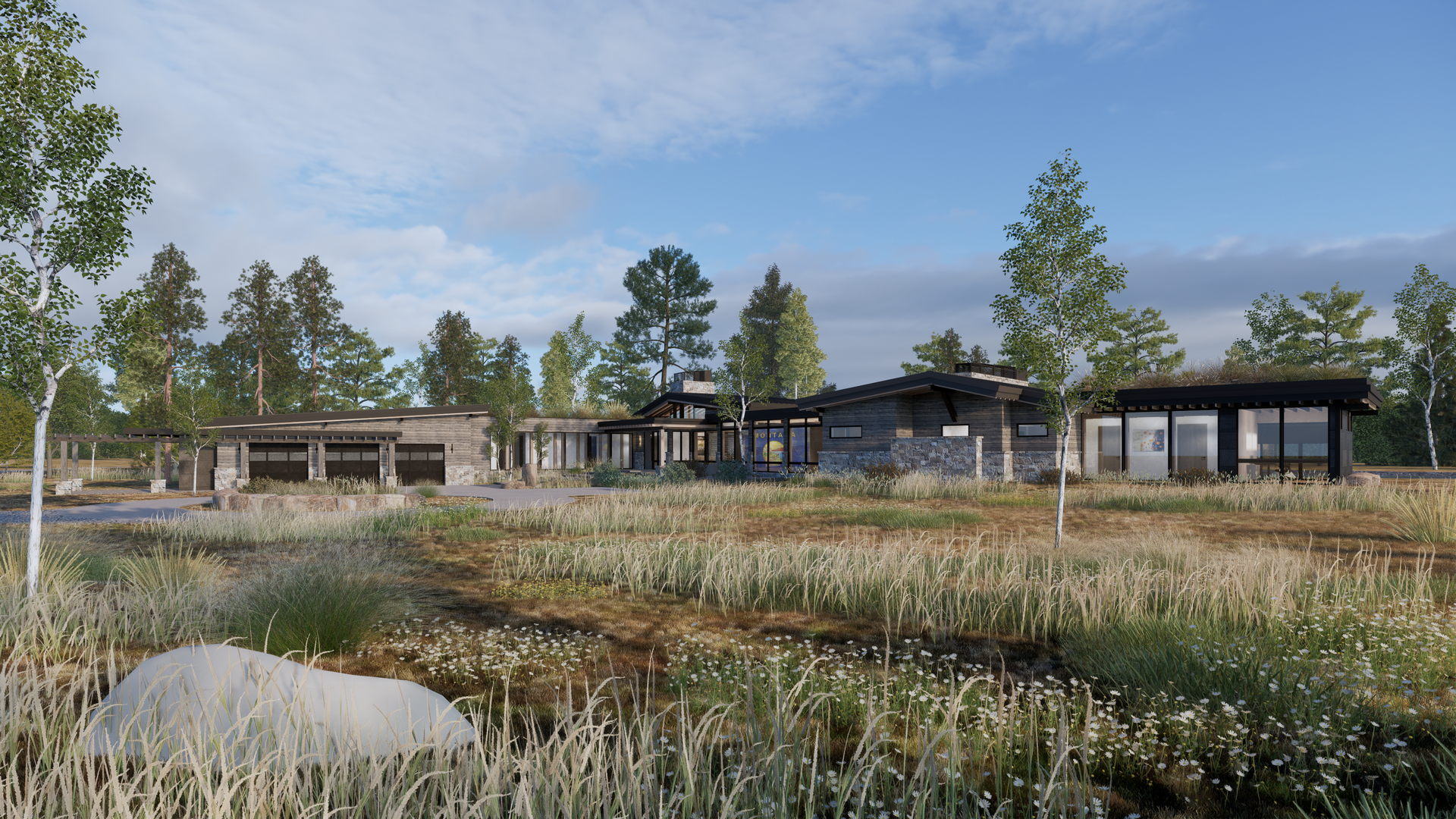 A large house is sitting in the middle of a field surrounded by trees.
