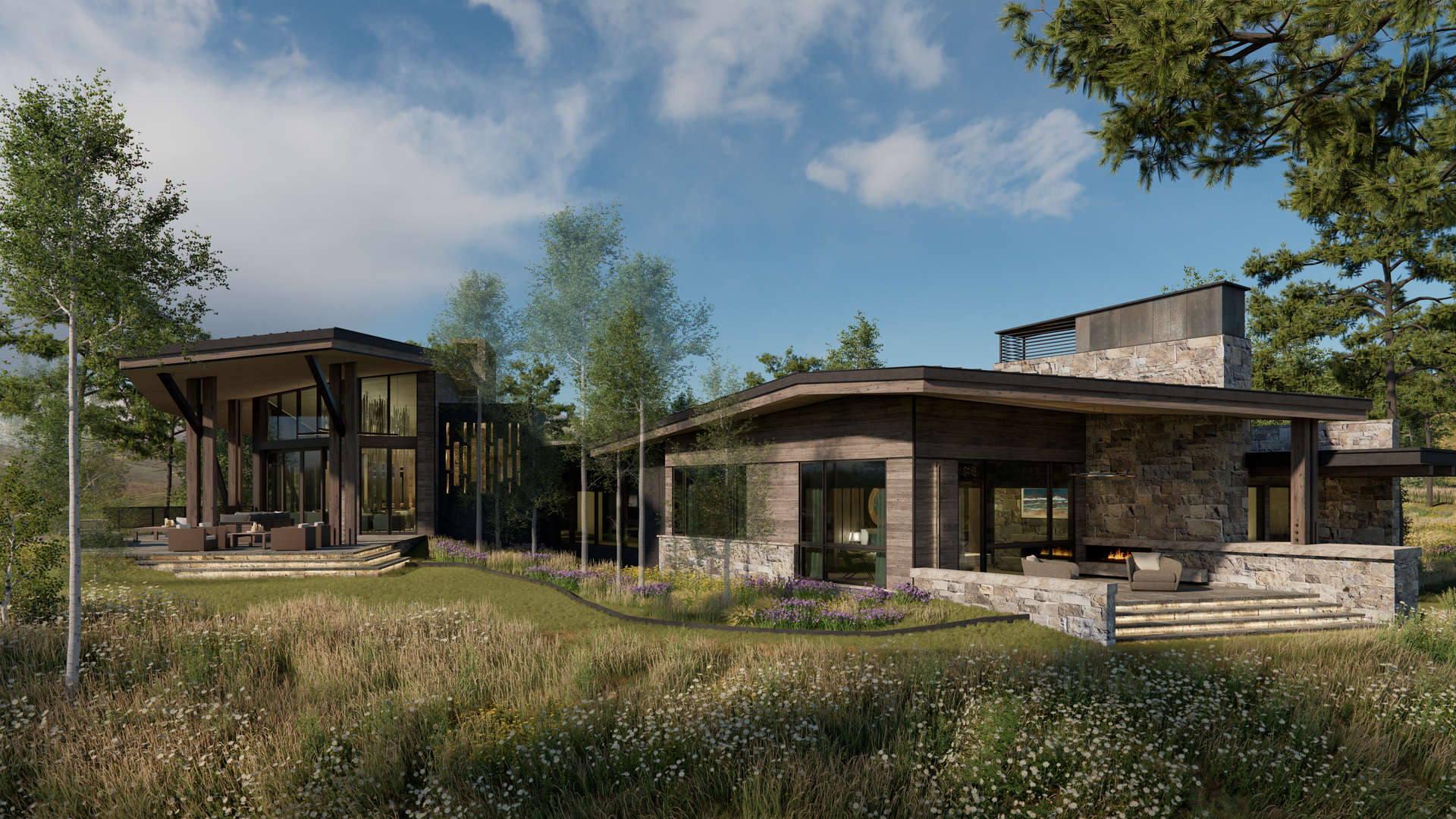 A large house is sitting in the middle of a field surrounded by trees.