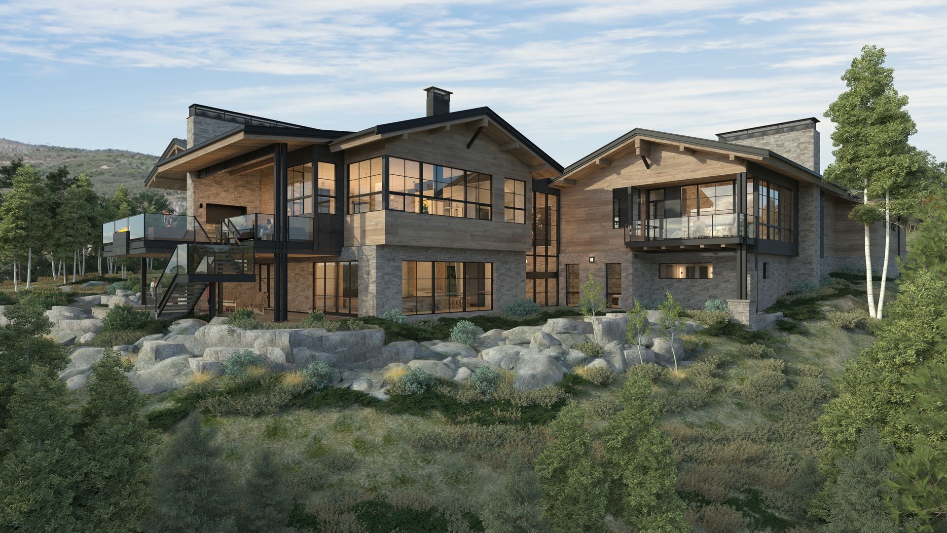 A large house is sitting on top of a hill surrounded by trees.