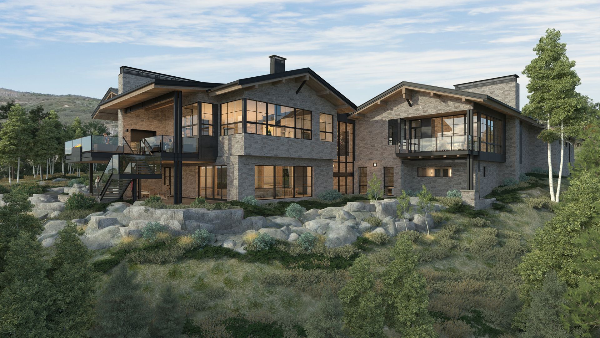 A large house is sitting on top of a hill surrounded by trees.