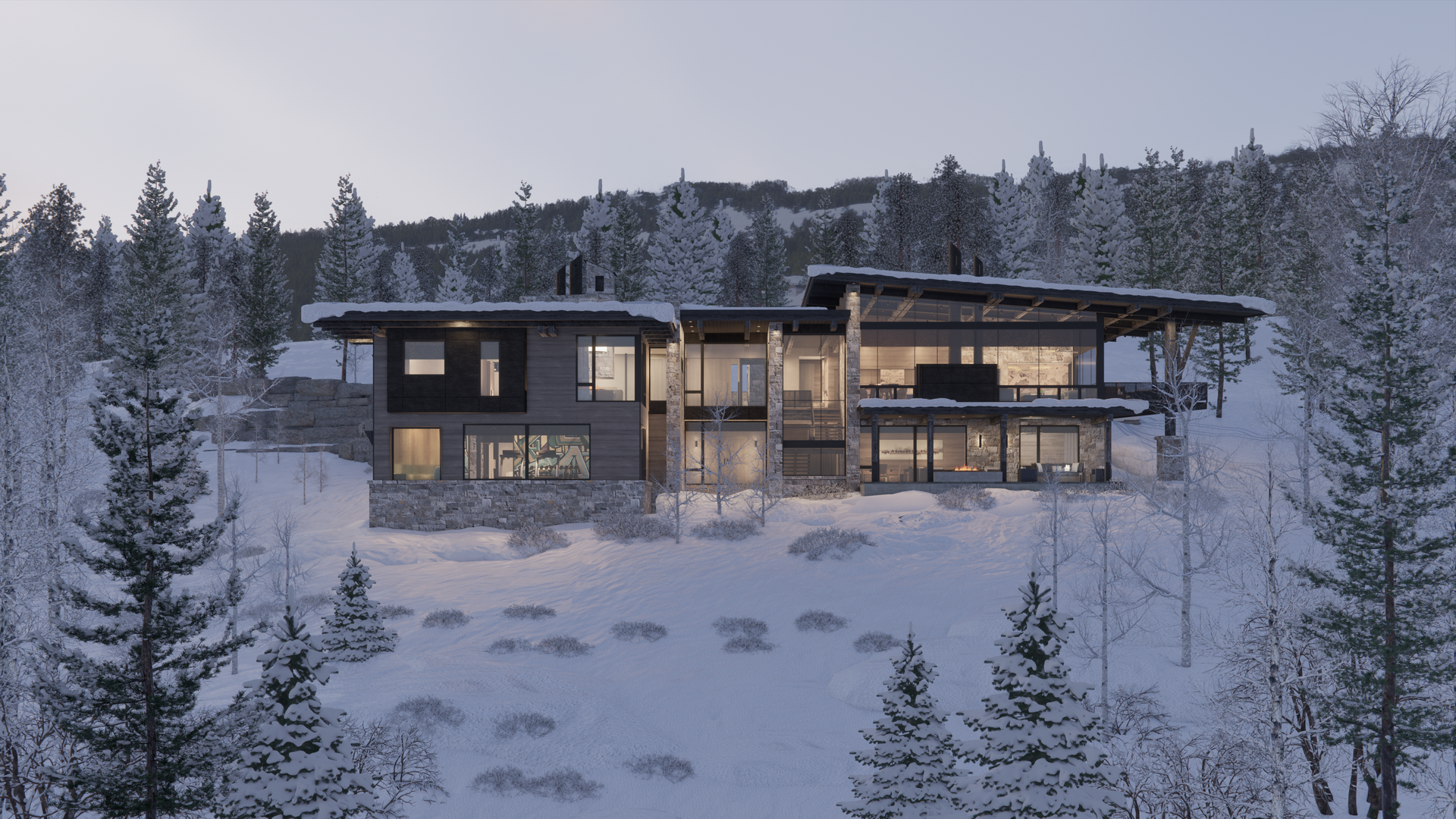 A large house is sitting on top of a snow covered hill surrounded by trees.