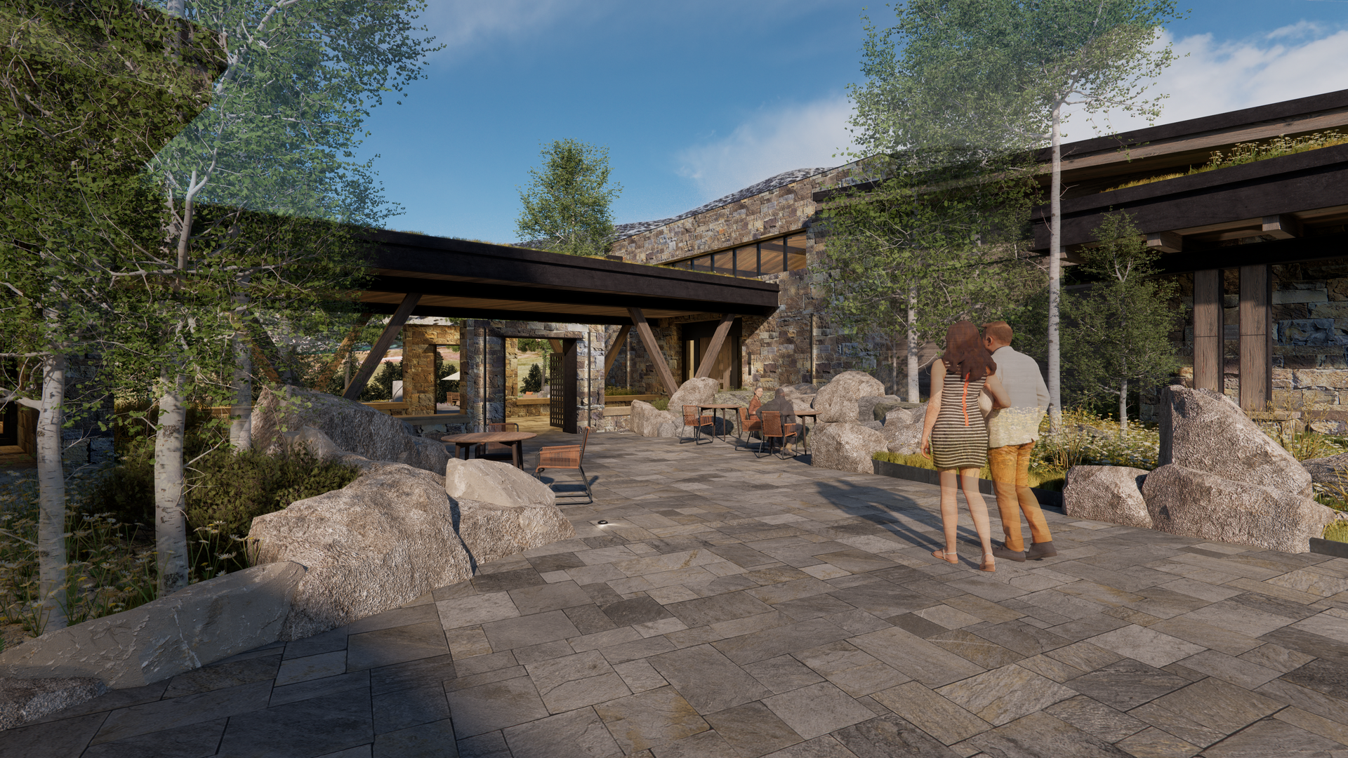 A couple is walking down a stone walkway in front of a house.