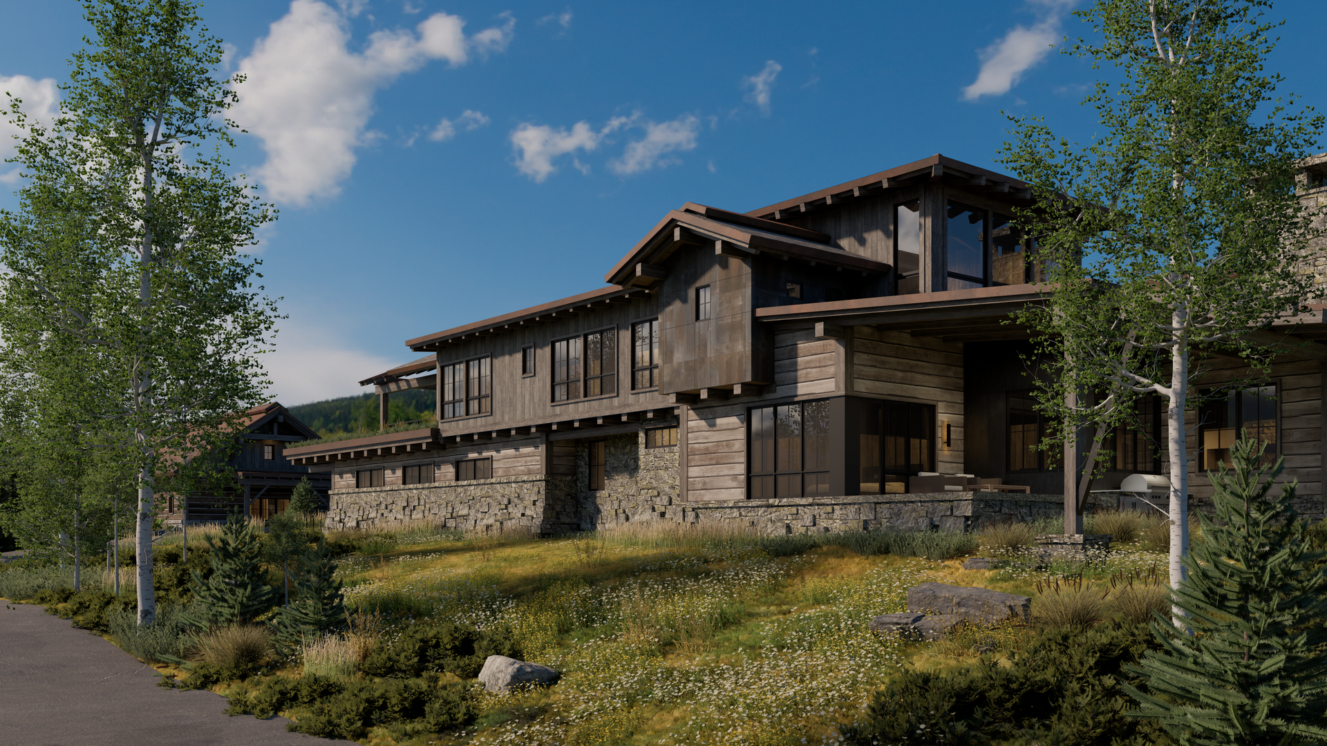 A large stone house is sitting on top of a hill surrounded by trees and grass.