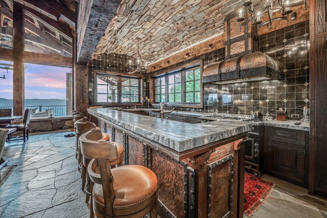 There is a large island in the middle of the kitchen.