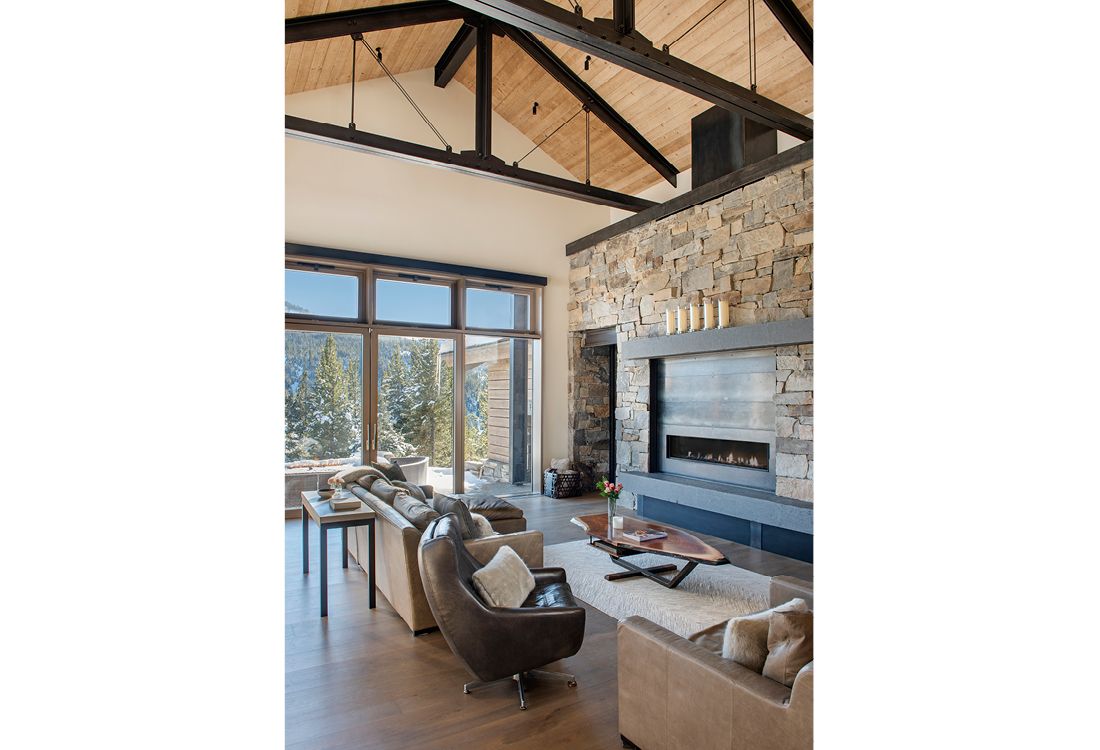 A living room filled with furniture and a fireplace.