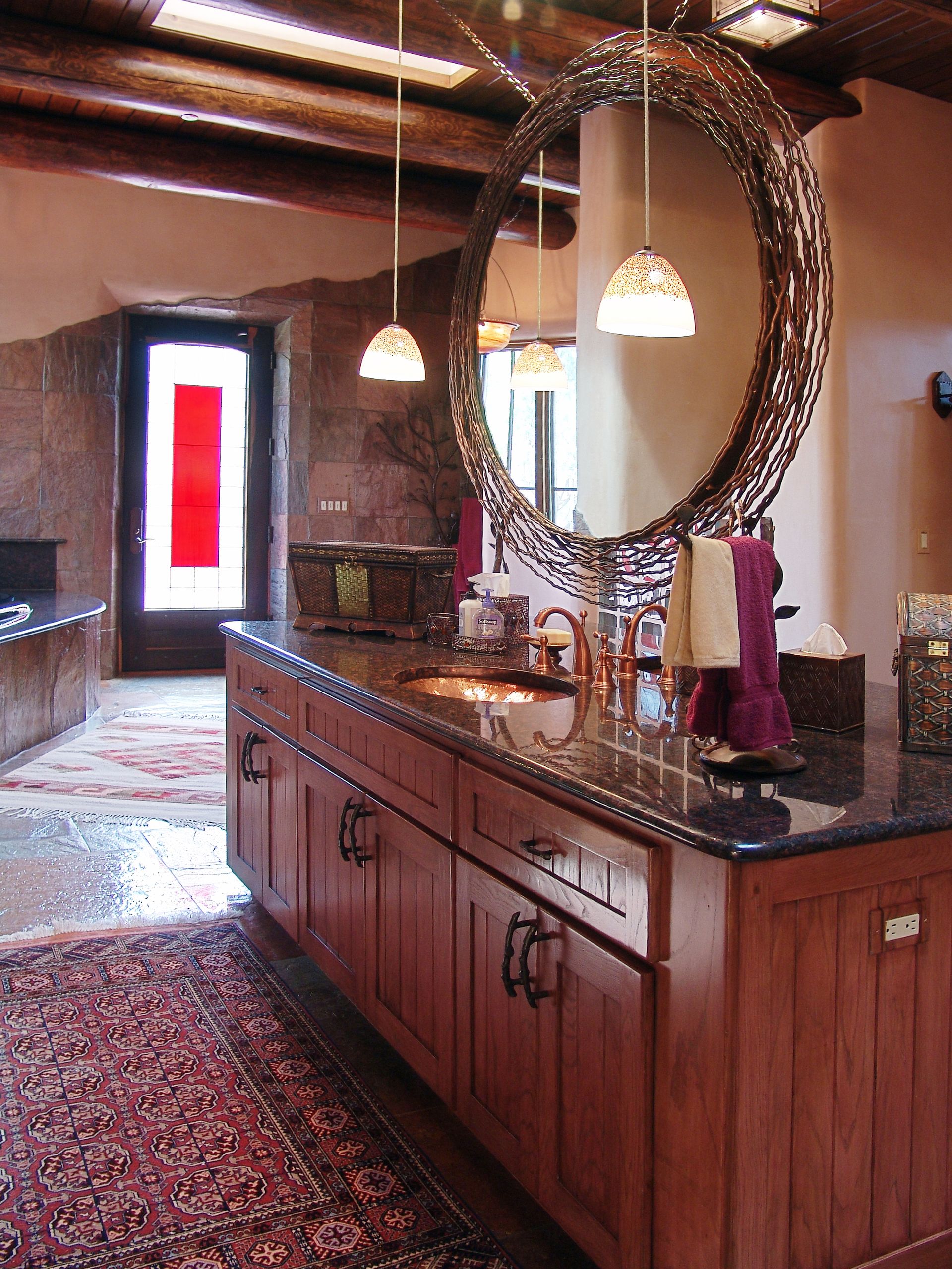 A bathroom with two sinks and a large mirror
