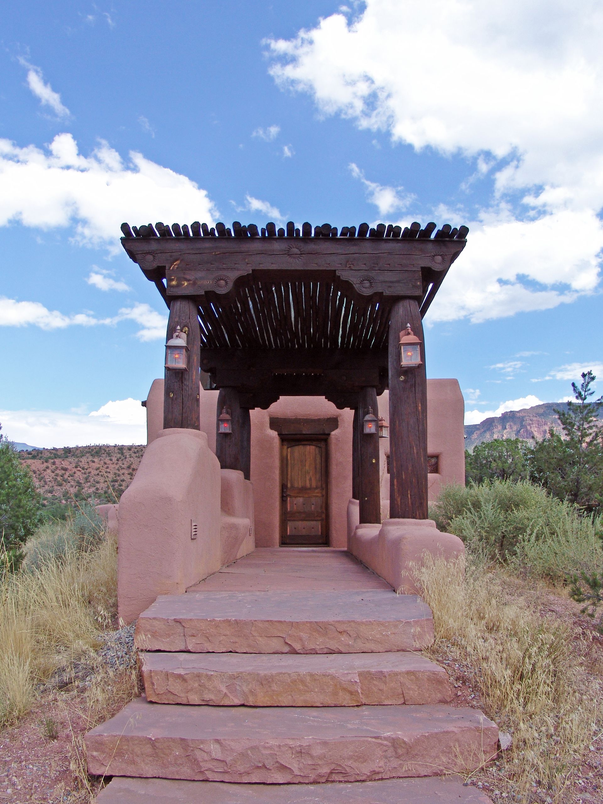 A small building with stairs leading up to it