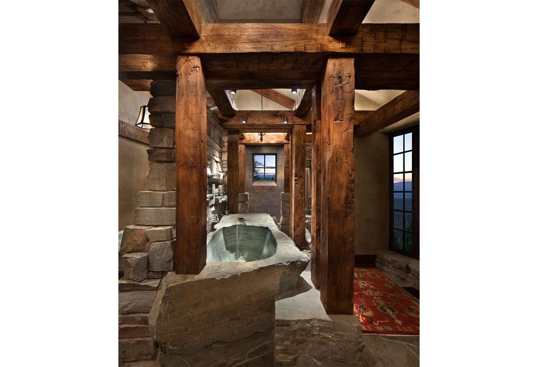 There is a large bathtub in the middle of the room.